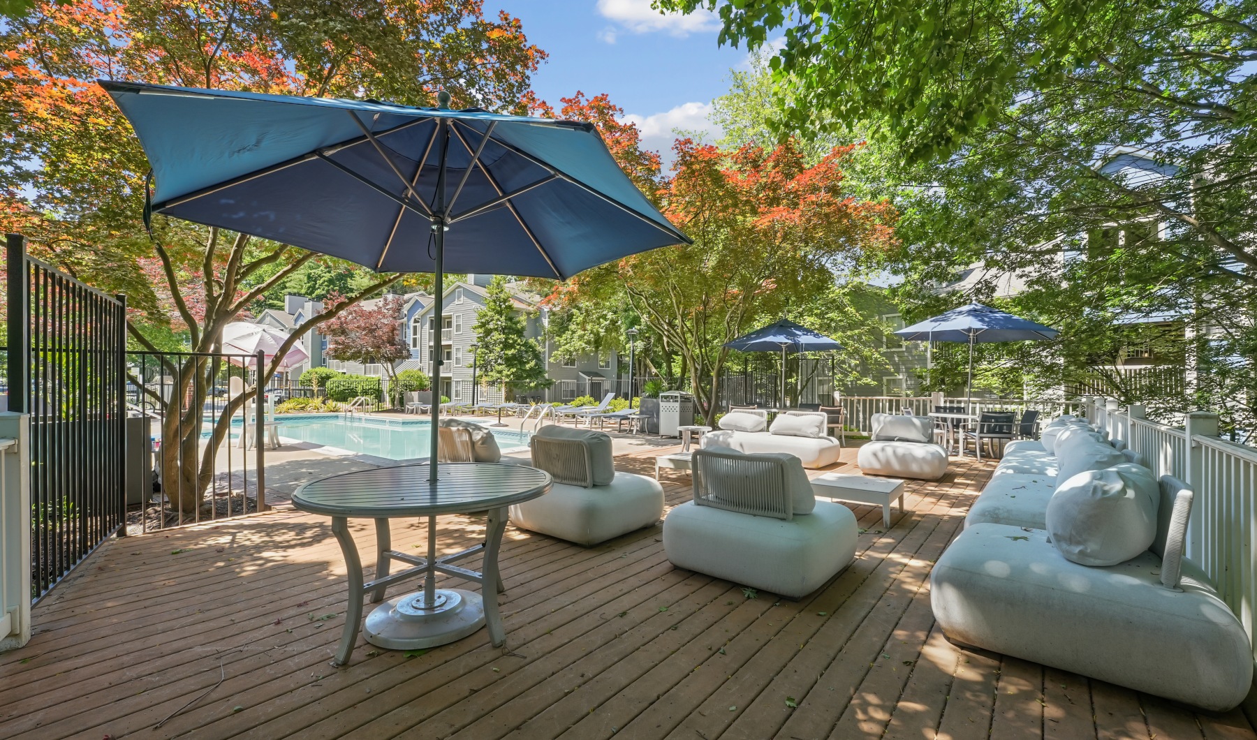 Resort-style swimming pool with lounge seating Resort-style swimming pool with lounge seating